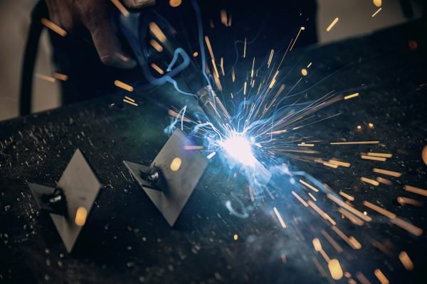 Worker welding the iron